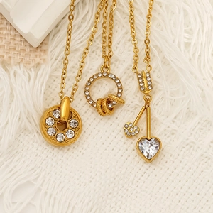 Three-piece stainless steel necklace set with heart and zircon pendants in gold finish