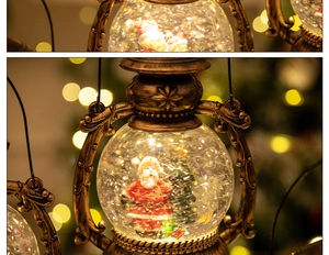 Detail of vintage bronze Christmas lantern with Santa scene and swirling glitter snow