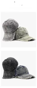 Detailed view of washed vintage baseball caps with distressed frayed edges in various colors