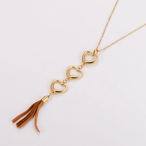Exquisite gold stainless steel necklace featuring hollow interlocking hearts and a brown tassel