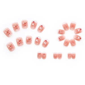 Pink short press-on nails with sweet cherry designs and white heart pattern accents