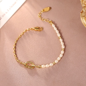 Elegant gold knot and white pearl mixed chain bracelet with adjustable lobster clasp