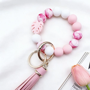 Food-grade silicone bead bracelet keychain with pink marble pattern and leather tassel
