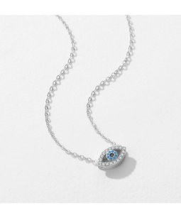 Macro detail of silver S925 necklace featuring an evil eye pendant with blue zircon stones