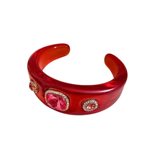 Vintage resin cuff bracelet with dark red gemstones and sparkling crystal accents