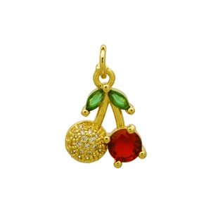Macro shot of cherry pendant with red crystal and sparkling pavé diamond details