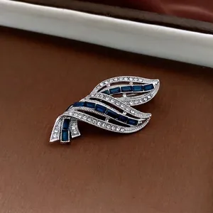 Elegant silver leaf brooch with blue zircon stones and sparkling crystals for women
