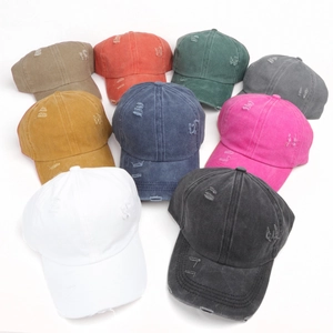Distressed washed cotton baseball caps in nine colors with vintage frayed hole design