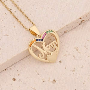 Close-up of 18K gold heart necklace with Mom engraving and colorful zircon stones