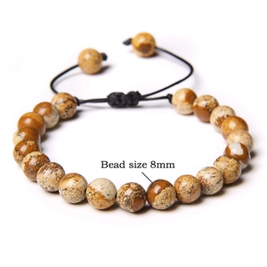 Detail of 8mm picture jasper beads on a handmade adjustable woven stone bracelet
