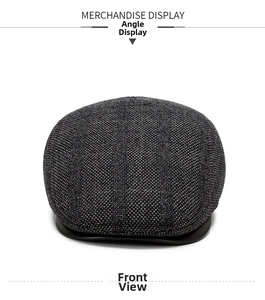Ivy cap detail showing black grey wool fabric texture and black leather brim finish