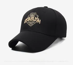 Detail view of the intricate gold embroidery on a premium black cotton baseball cap