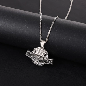 Silver iced-out hip hop necklace with dollar-themed pendant on a rope chain