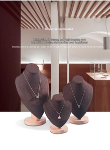 Three-piece tiered wooden and suede necklace bust stands for jewelry window displays