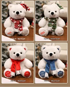 Detail view of four polar bear plush toys with Christmas scarves and embroidered paws