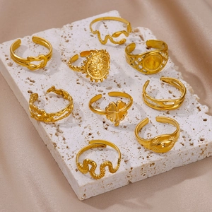 9-piece gold-plated stainless steel ring set with snake, clover, and evil eye motifs