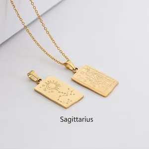 Detail of gold rectangular Sagittarius zodiac pendant with sun and moon engravings