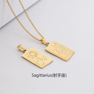 Detail of gold rectangular Sagittarius zodiac pendant with sun and moon engravings