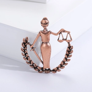 Vintage bronze Lady Justice scales brooch with sword and laurel wreath detail