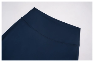 Close-up of high-waist dark blue yoga pants featuring durable double-stitched seams