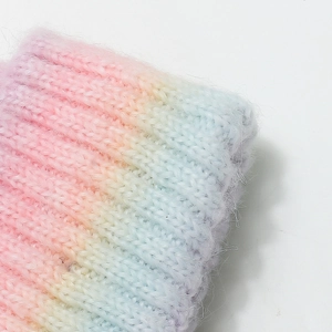 Macro shot of fluffy mohair rainbow gradient knit texture with soft pastel colors