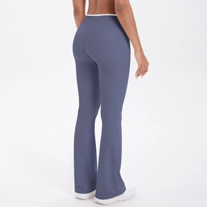 Rear view of high-waisted flared yoga leggings in greyish blue with body-shaping fit