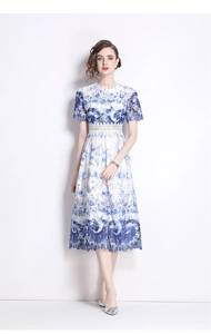 Detail of the blue and white floral lace embroidery on this elegant midi dress