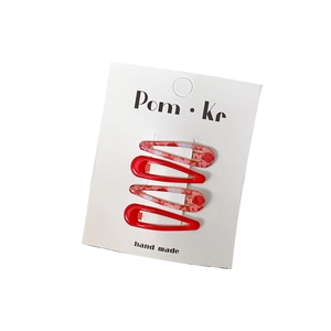 Set of 4 cute floral and solid red snap hair clips for girls on display card