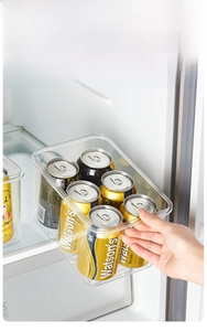 Pulling out a transparent fridge organizer box with -20°C low temperature resistance