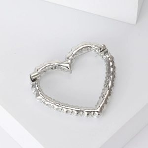 Minimalist silver-toned hollow heart brooch with delicate pearl-like beads and pin back