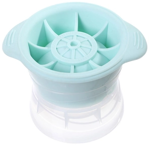 Light blue sphere ice mold with dual handles and transparent base for whiskey ice balls