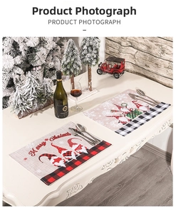 Detail of Christmas gnome placemats with classic plaid edges and festive embroidery