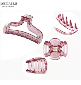 Detail view of pink translucent hair claw clip with golden spring and durable bite teeth