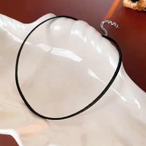 Minimalist black leather choker necklace with silver-tone metal extender and clasp for women