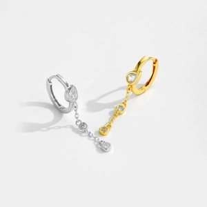 Macro detail of S925 sterling silver tassel earrings with clear cubic zirconia stones