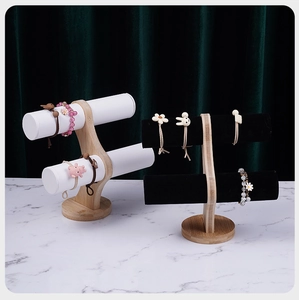 Dual-tier jewelry display stand with bamboo base and white leather or black velvet rollers