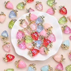 Colorful resin strawberry pendants in red pink and blue with gold metal leaf for DIY jewelry