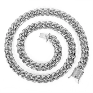 Detailed macro view of 12mm silver Cuban chain with iced out box clasp on white background