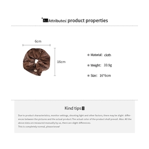 Detail view showing dimensions and 33.9g weight of brown cloth floral scrunchie
