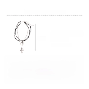 Detailed view of layered leather necklace featuring glass beads and silver alloy crosses
