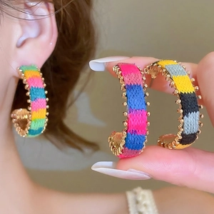 Bohemian C-shaped earrings with colorful hand-woven yarn and golden metal beads