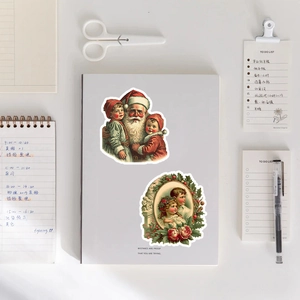 Close-up of vintage Christmas stickers with Santa on notebook cover for DIY crafts