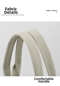 Close-up of the durable woven canvas handles on a minimalist cream shoulder tote bag