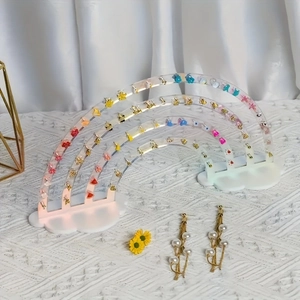 Rainbow acrylic earring holder with cloud base showing multiple jewelry storage slots