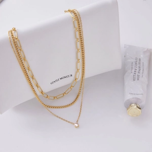 Collier triple rang en acier inoxydable doré avec maille trombone et pendentif zircon