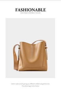 Detail einer braunen Leder-Eimertasche mit breitem Gurt und strukturierter Oberfläche