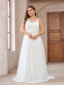 Plus size white satin wedding gown with lace trim and elegant cowl neck trailing skirt