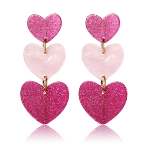 Asymmetric pink heart drop earrings with glitter and matte finish in gold setting