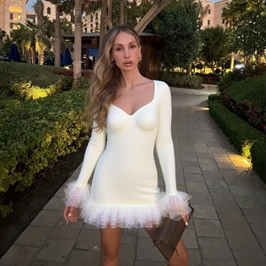 White long-sleeve textured knit mini dress with heart neckline and ruffle mesh hem