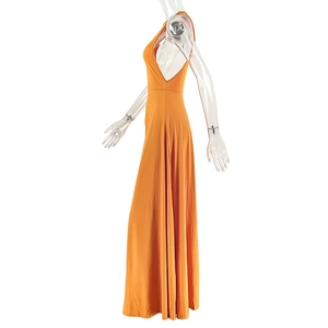 Detailed side view of orange sleeveless maxi dress with waist ruching and backless design